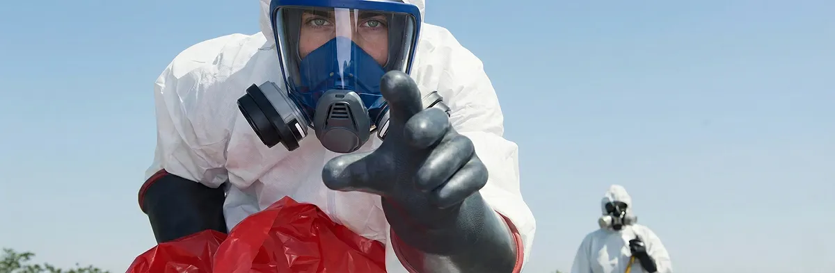 sewage clean up technician wearing protective gear handling biohazard materials in Las Vegas, NV